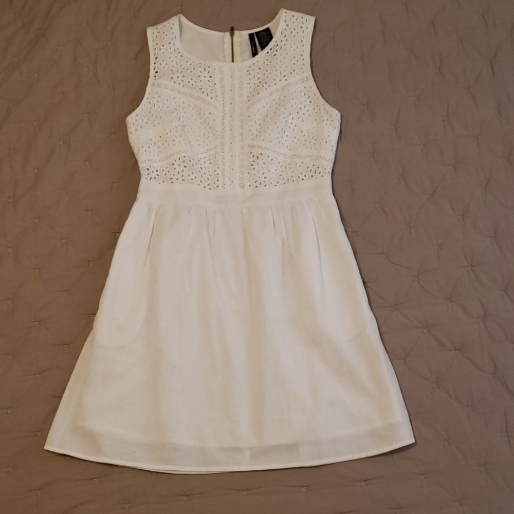 Sleeveless white cotton dress, eyelet detailed top